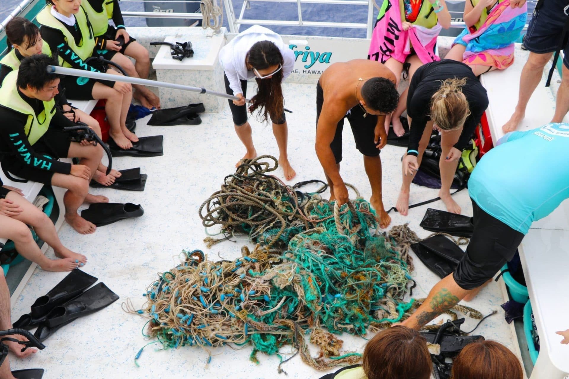 Dolphins and You crew removes trash from the ocean