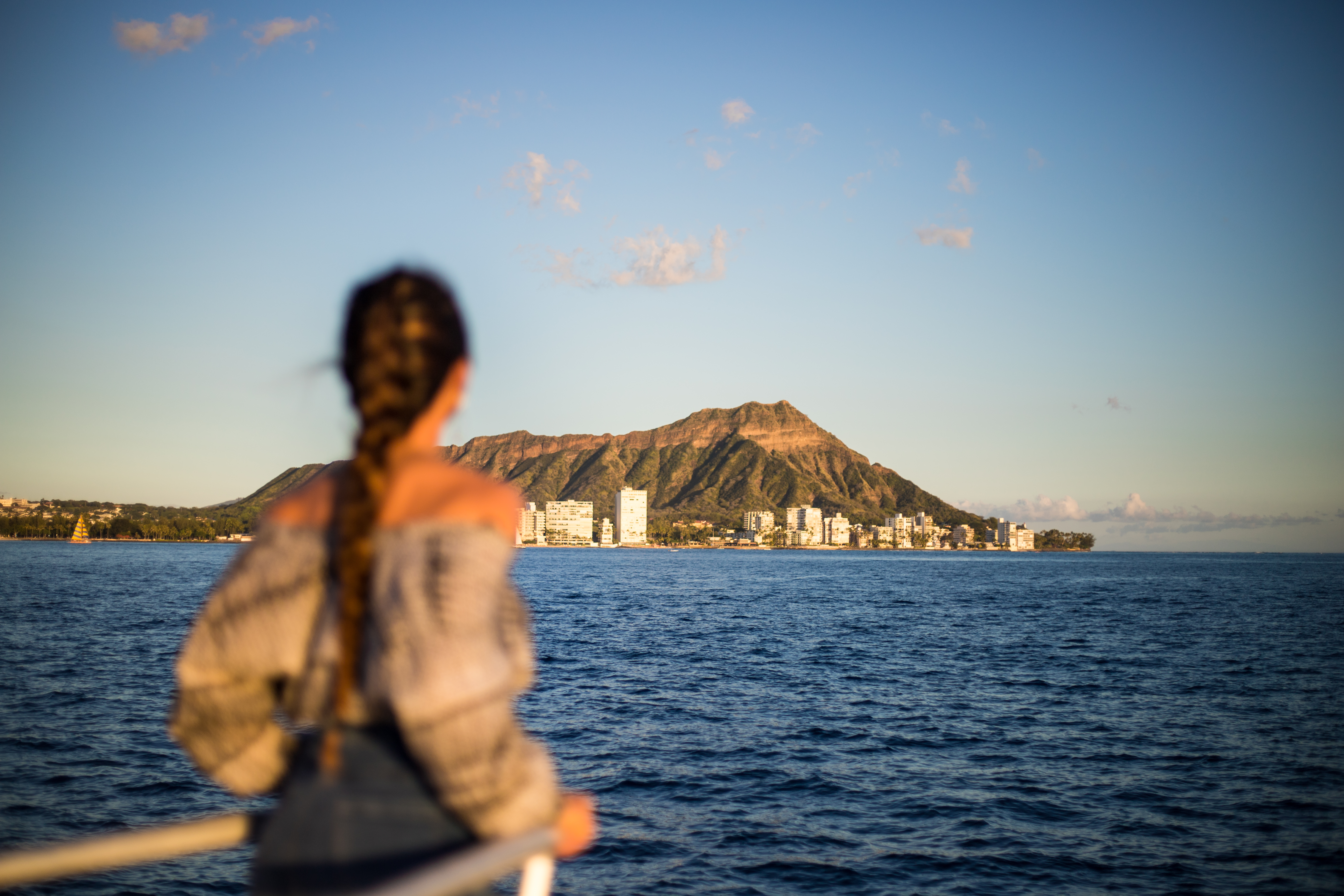 Take in Diamond Head at sunset as you sail past the Honolulu coastline.