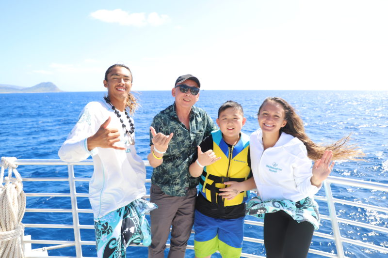David and Justin, who attended all AYC Oahu tours, pose with Dolphins and You staff.
