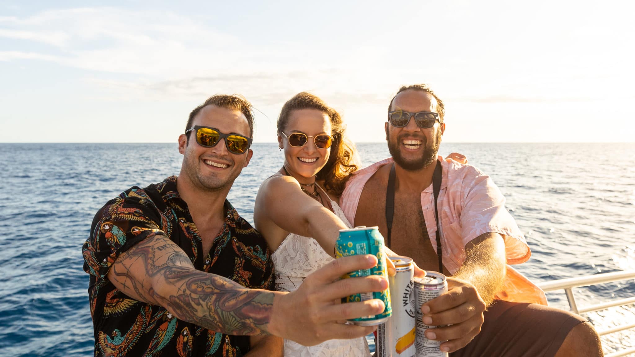 Guests cheers on Ocean and You BYOB Waikiki booze cruise