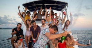 Guests pop champagne on the best Hawaii booze cruise