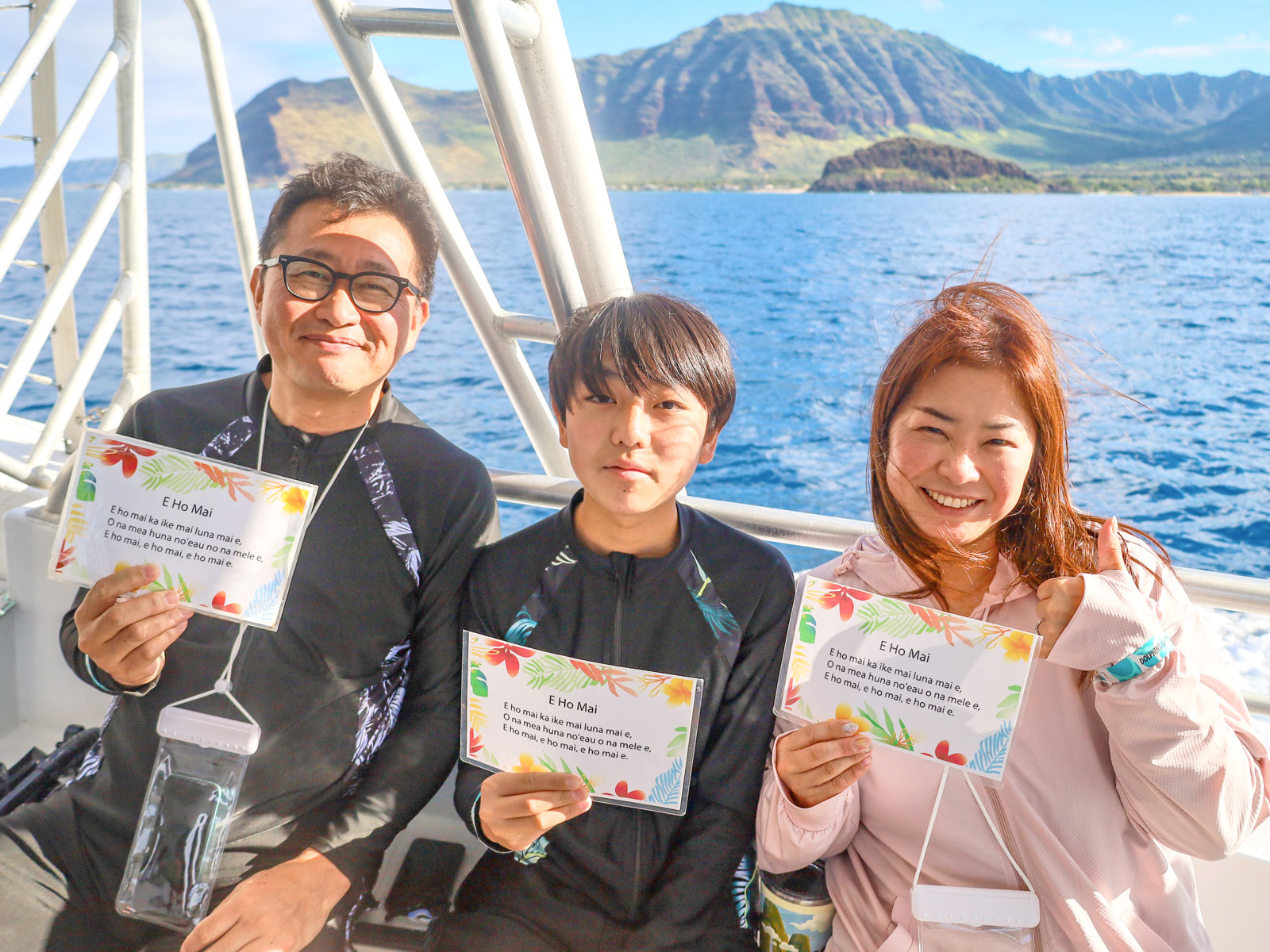 Guests with E Ho Mai chant cards off the Waianae coast