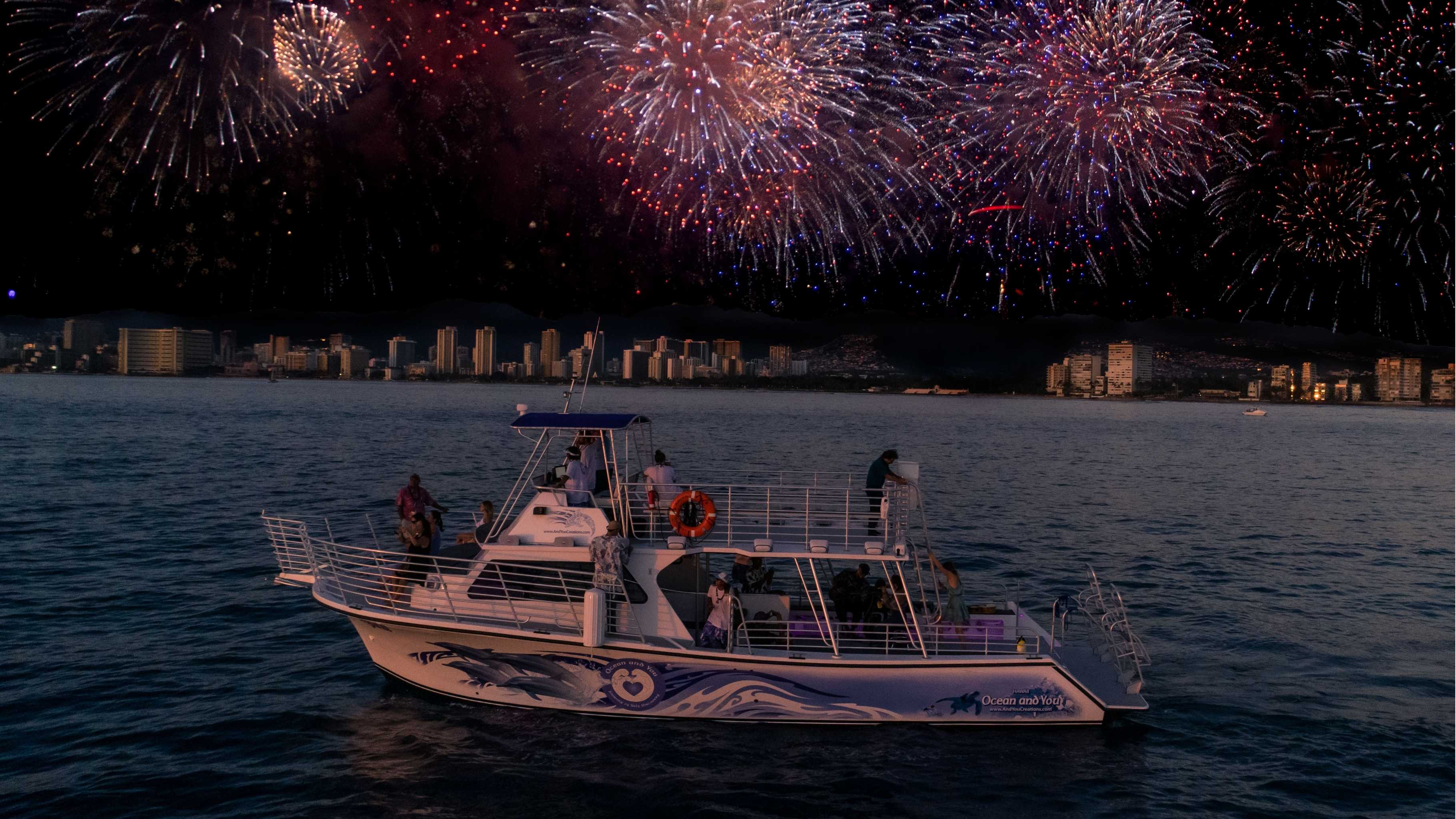 Guests enjoying fireworks on the Waikiki New Year’s Eve Cruise 2026 from the ocean